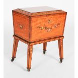 A 20th century painted satinwood work box on integral stand, the sarcophagus-shaped box with