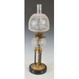 A late 19th/ early 20th century brass oil lamp, with clear and frosted cut glass shade, the burner