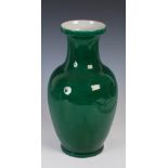 A Chinese green ground monochrome vase, 20th century, bearing Yongzheng six character mark but