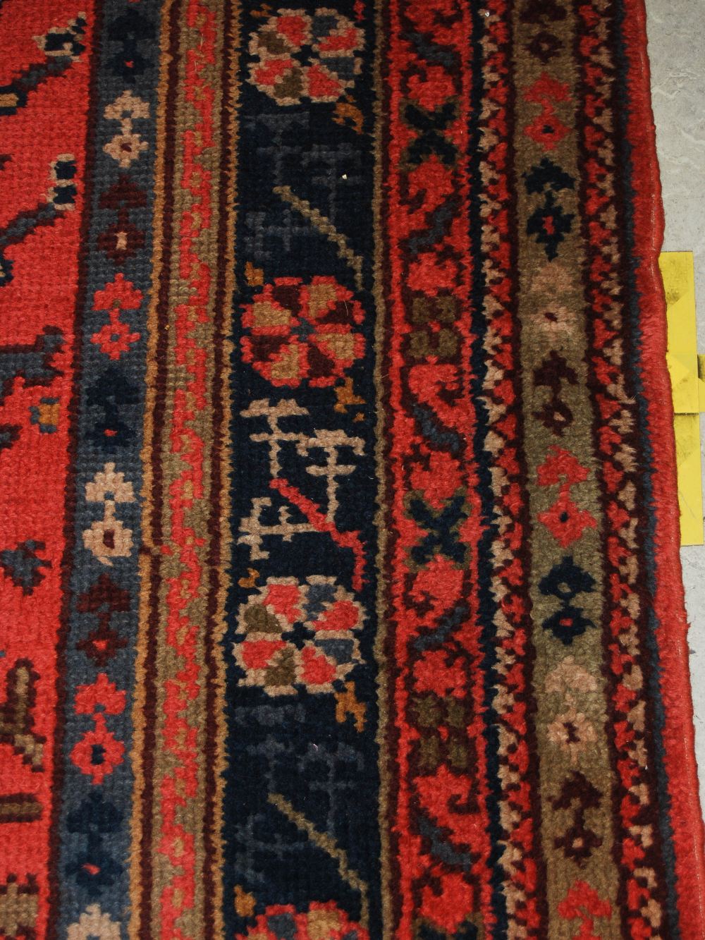 A late 19th/ early 20th century Ushak carpet, the madder ground decorated with flowers and - Image 7 of 8