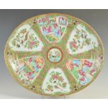 A Chinese porcelain Canton famille rose platter/ oval shaped serving dish with Armorial 'PRENEY