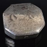 An early 18th century silvered steel octagonal snuff box, the hinged cover engraved in cursive