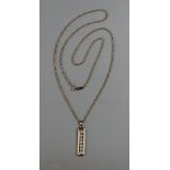 Gold 7 stone diamond pendant on a gold rope chain