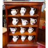 Set of 12 Royal Worcester miniature boxed jugs with C.O.A and display shelves