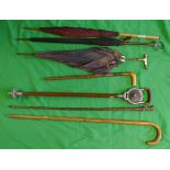 Collection of walking sticks and umbrellas to include a shooting stick and a hallmarked silver