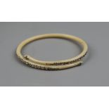 Art Deco cream celluloid bangle modelled as a double headed serpent