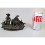 19thC bronze ink well and pen holder in the form of a child feeding a dog