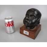Bust of baby on wooden base - Approx height 17cm
