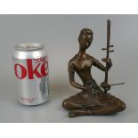 Bronze figure of sitting musician