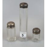 3 Silver topped glass bottles