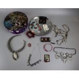 Tin of costume jewellery