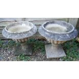 Pair of antique stone pedestal planters