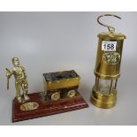 Welsh brass miners lamp together with miner and coal cart figure