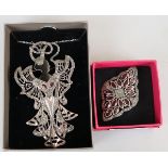 Large silver Art Nouveau pendant on chain together with silver and garnet brooch