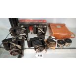 Collection of vintage folding cameras etc