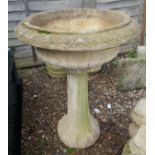 Large stone planter on plinth