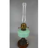 Victorian oil lamp with light blue reservoir