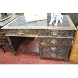 Antique carved oak leather top desk depicting Green Man - Approx. size W: 122cm D: 69cm H: 75cm