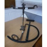 Stirrup pump and a set of antique scales