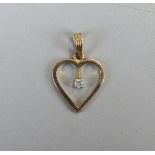 Gold diamond set heart shaped pendant