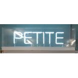 Large working neon 'PETITE' sign