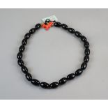 Kenneth J Lane black bead necklace with coral coloured clasp
