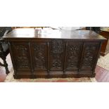 Circa 16thC large carved oak coffer with linen-fold panels to the sides and carved figures to