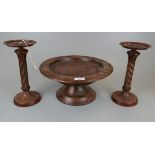 Pair of Corinthian wooden candlestick together with a treen fruit bowl