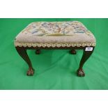 Foot stool on ball and claw feet with tapestry upholstery