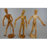 Three articulated wooden figures