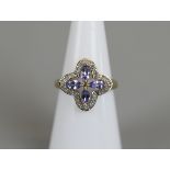 Gold tanzanite and diamond ring - Size K