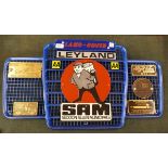 Collection of badges to include SAM, Carrimore mounted on Land Rover grill