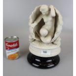 Parian ware figure of lady in shell - Approx H: 21cm