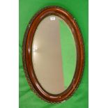 Antique oval bevelled glass mirror