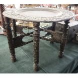 Well carved Indian brass topped occasional table