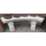 Curved stone lion head bench
