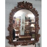 Ornate mirror adorned with cherubs