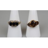 2 gold stone set rings