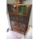 Oriental themed corner cabinet with well carved panels