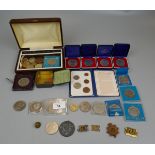 Collection of coins and military badges