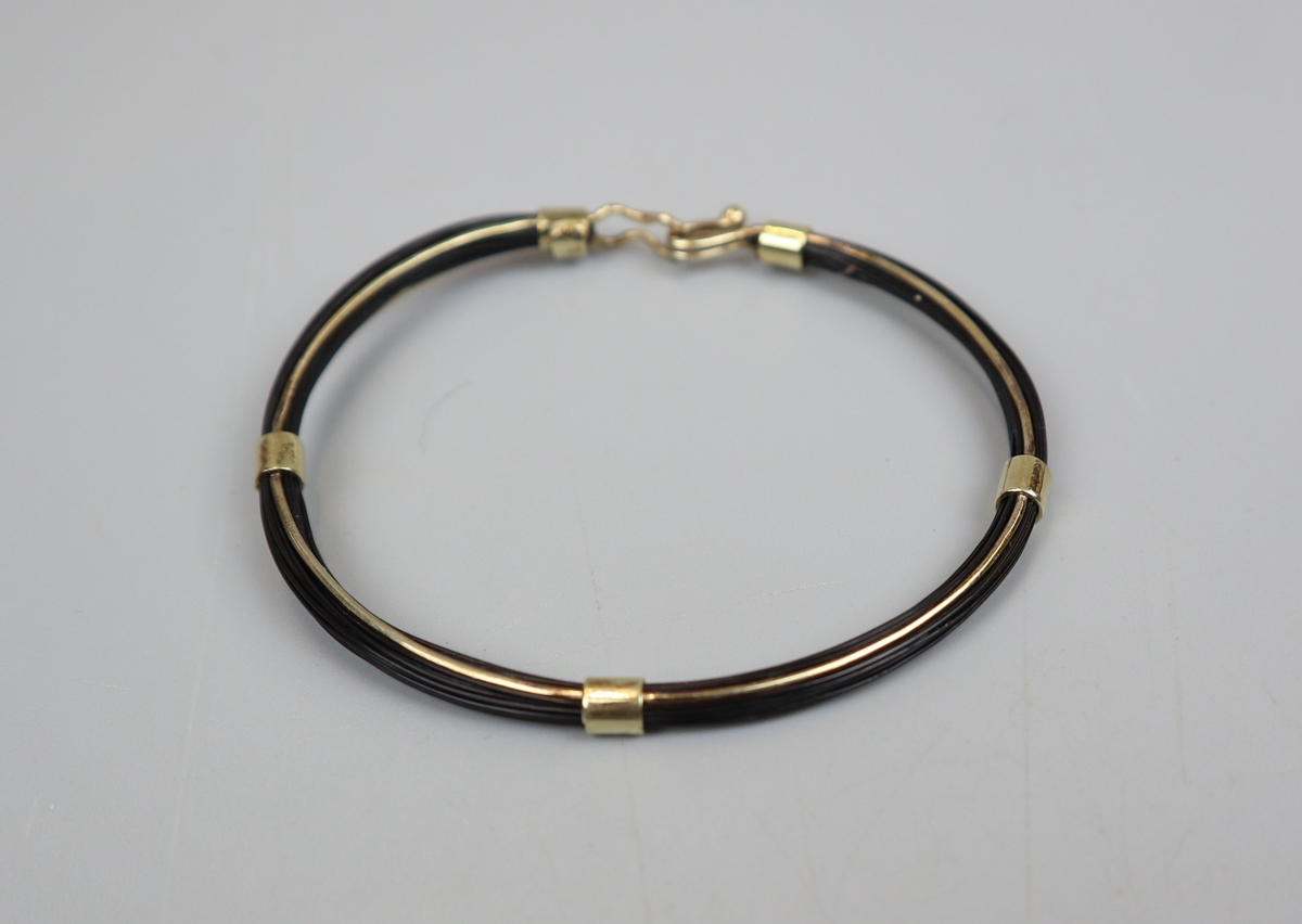 Gold and elephant hair bangle