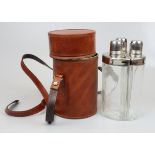 3 hip flasks in leather case