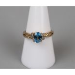 Gold blue topaz & diamond set ring - Size P