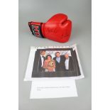 Signed boxing glove together with a signed photograph Steve Collins and Richie Woodall