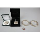 Collection of silver jewellery to include 2 bangles, 2 lockets and a ring