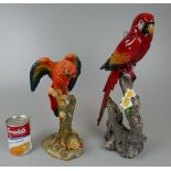 2 colourful exotic birds in textured and glazed finishes perched on branches. Approx H: 39cm &