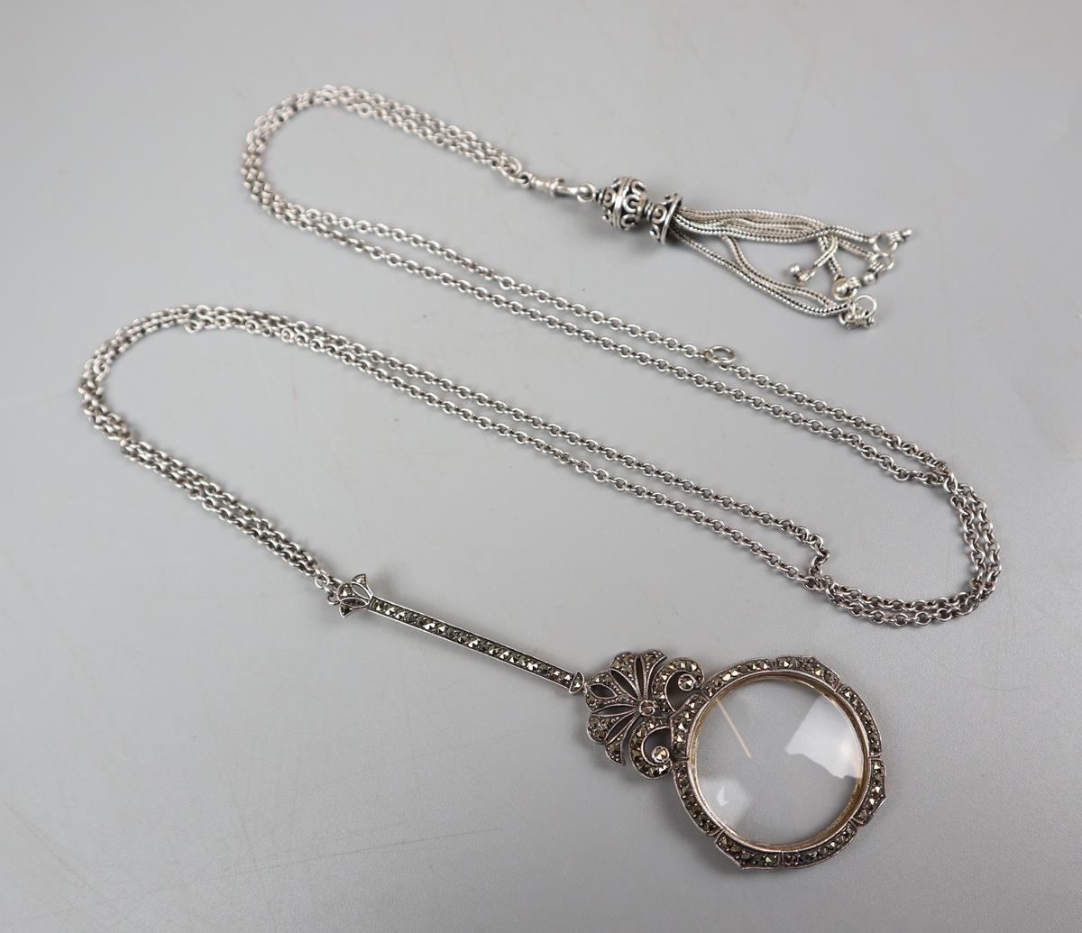 Silver magnifying glass on silver chain