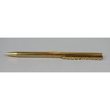 A French classique ballpoint pen, the slender 18ct gold body having decorative clip with 22 claw set