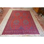 Large red patterned rug - Approx size: 312cm x 203cm