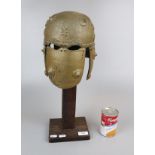 Model of Persian helmet on stand